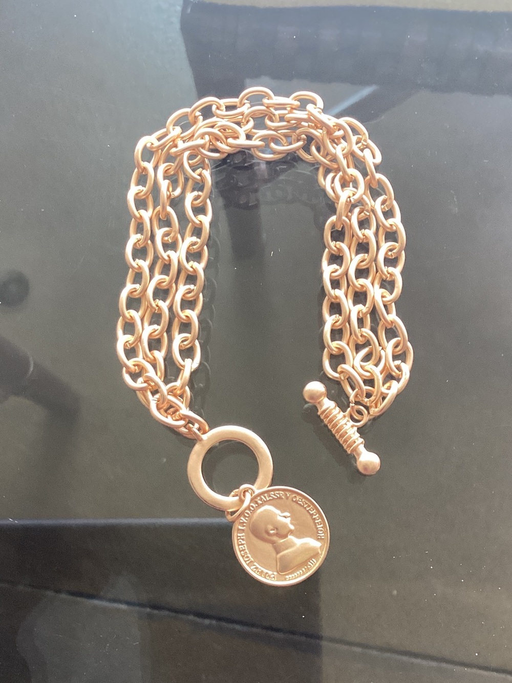 Gold bracelet with coin